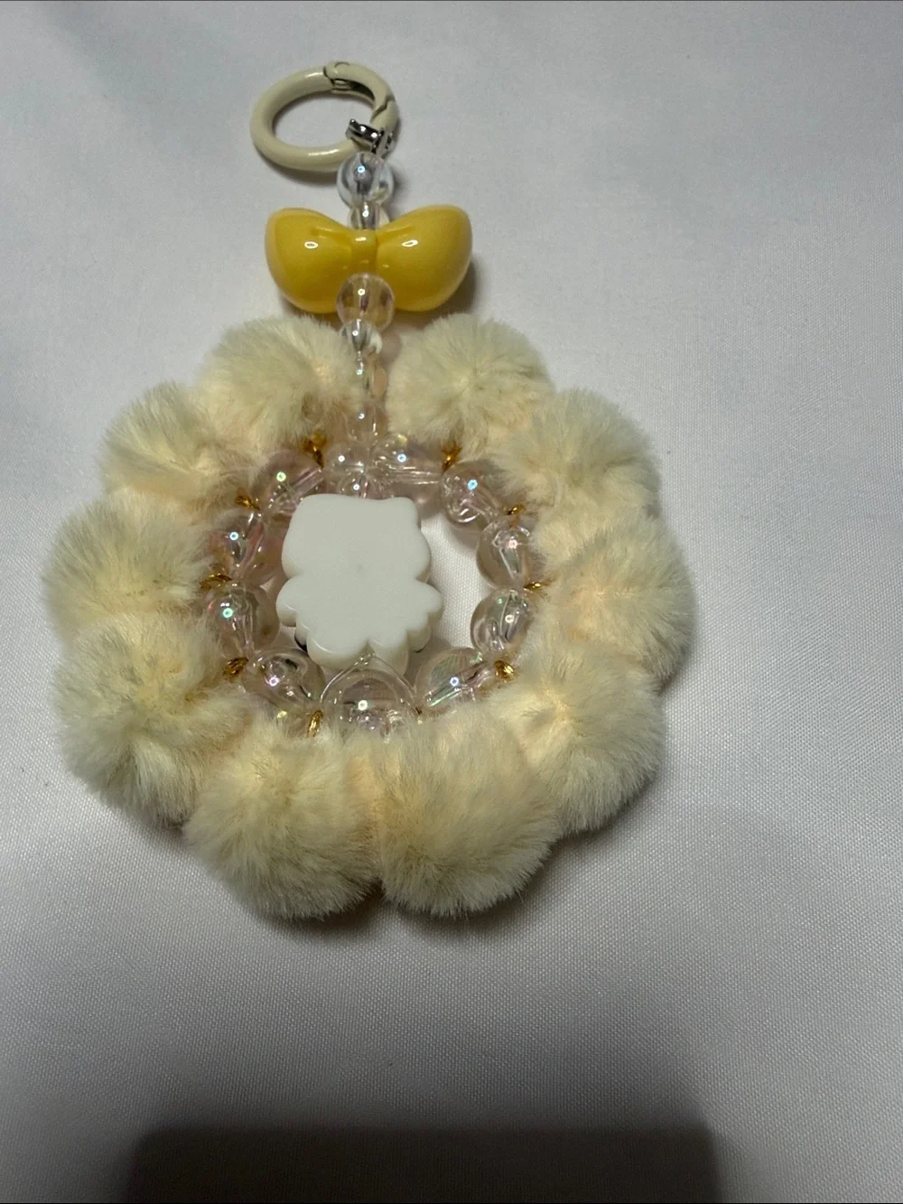 Hello Kitty Cream Faux Fur Pom Keyring with Yellow Bow & Pink Accent